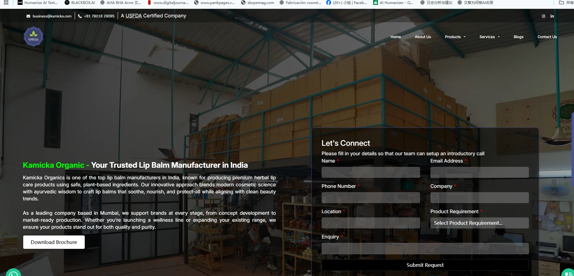 Kamicka Organic's warehouse with stacked boxes and contact form overlay offering lip balms crafted with Ayurvedic wisdom.